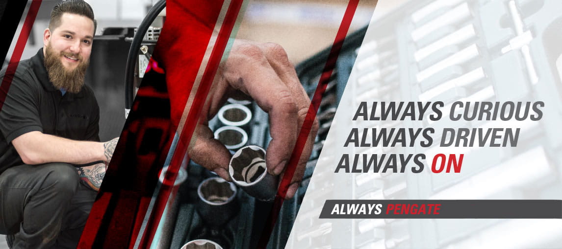 A Pengate technician services a Raymond lift truck in a customer's warehouse.