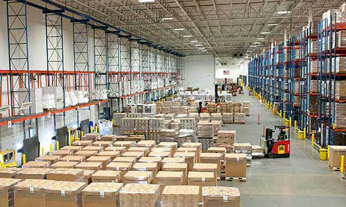 Products and lift trucks in warehouse during consultation